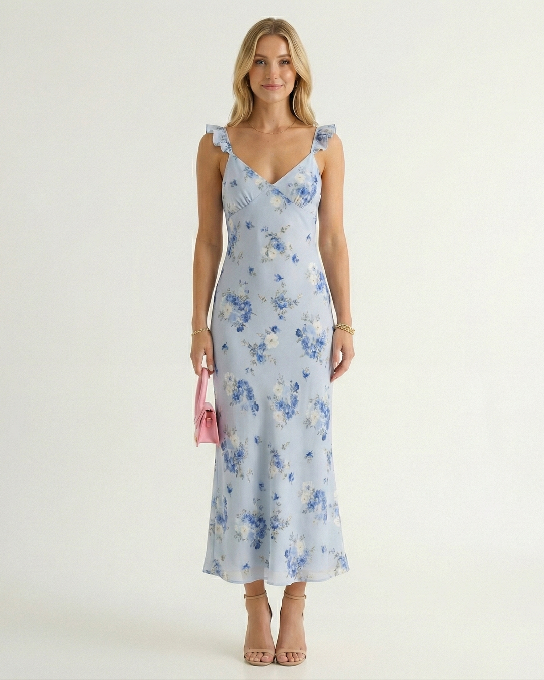 Vibrant floral print spaghetti strap midi dress for women, stylish backless summer design, great for resort & party.