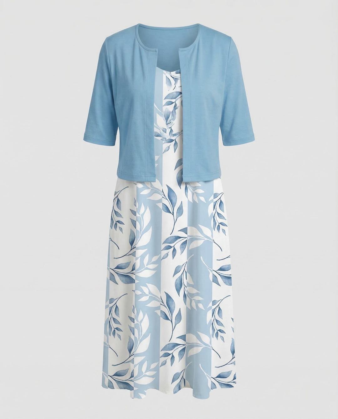 Women's elegant floral two-piece set worn by a model, featuring a stylish crop top and flowy midi skirt.