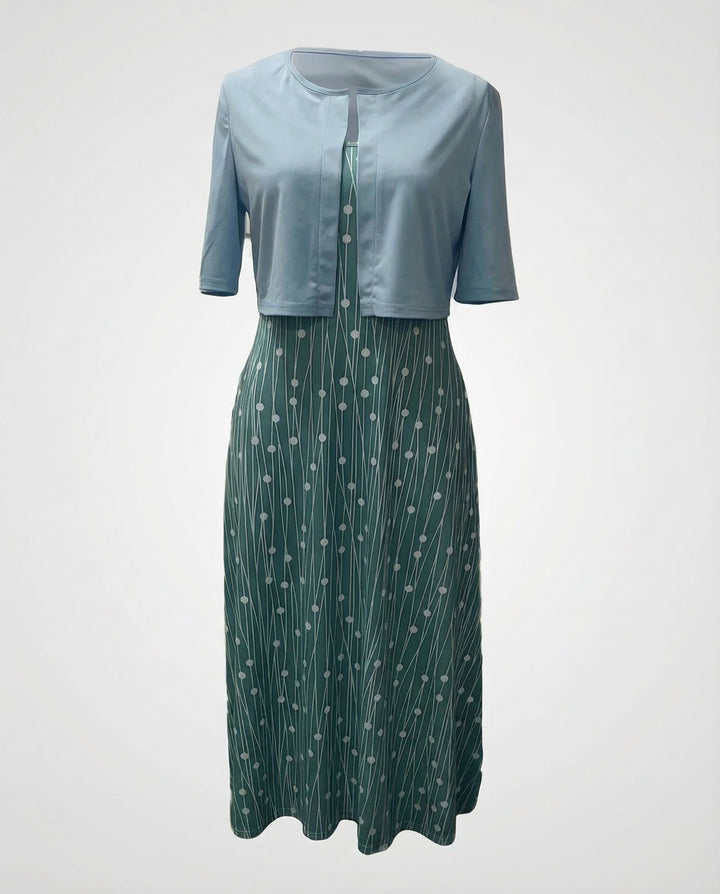 Vibrant floral pattern on this elegant two-piece women's dress set, including a crop top and midi skirt.