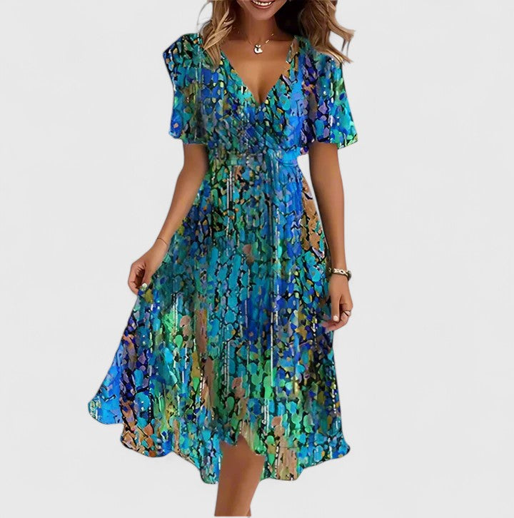 Elegant women's floral V-neck midi dress, perfect for summer occasions. Features a vibrant, flowy print.