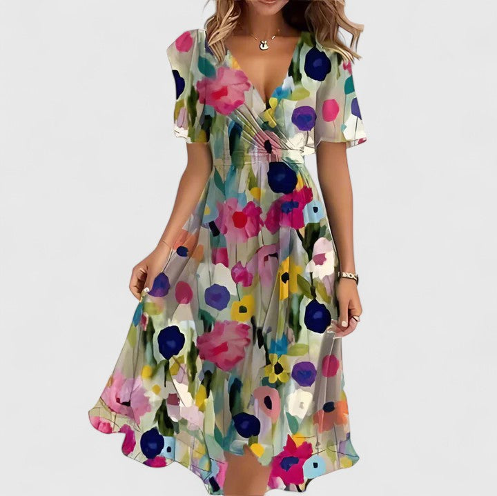 Feminine V-neck floral midi dress for women, ideal for casual summer day wear. Soft, flowy fabric.