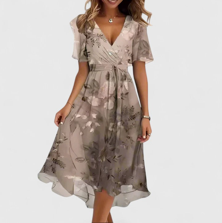 Side view of a flowy women's elegant floral V-neck midi dress, perfect for summer fashion and movement.