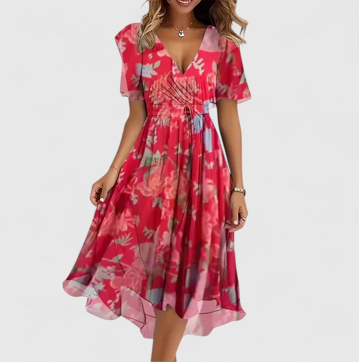 Model wearing a feminine floral V-neck midi dress for women, an elegant and vibrant choice for summer.