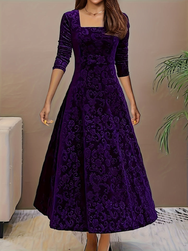 Sophisticated women's velvet midi dress with a beautiful floral print and elegant 3/4 length sleeves.