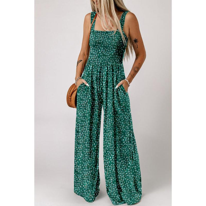 Back view of women's floral wide-leg jumpsuit, highlighting its elegant spring fashion design.