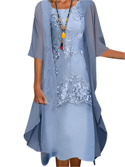 Elegant women's flowing midi dress with sheer sleeves, perfect for a wedding guest or formal summer event