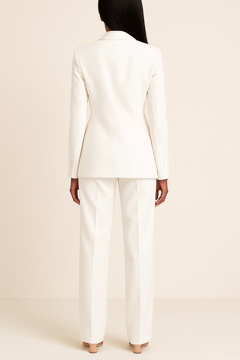 Sophisticated women's two-piece formal suit set with a long elegant blazer and slim trousers.