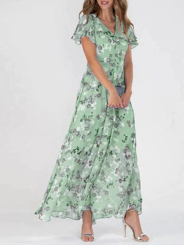 Women's flowy maxi dress, glamorous and elegant, perfect as a summer party or vacation dress.