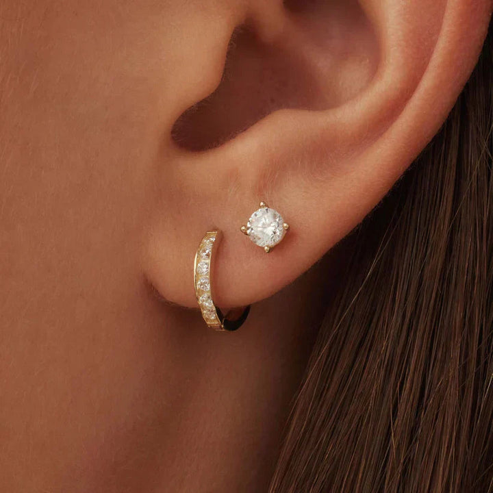 Beautiful women's gold earrings with sparkling stones, an elegant jewelry gift for her.