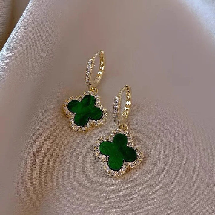 Elegant women's gold-plated lucky clover leaf earrings with sparkling crystals. Perfect gift for her.