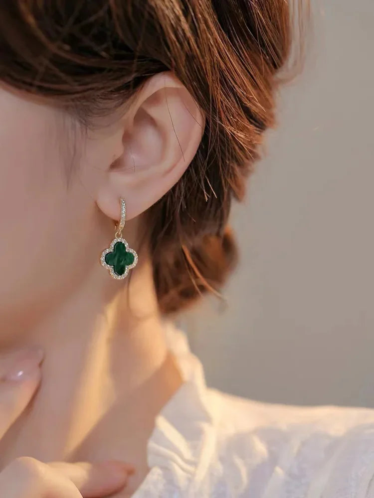 Women's gold-plated clover leaf earrings with crystals. Elegant, perfect for everyday wear or as a thoughtful gift.