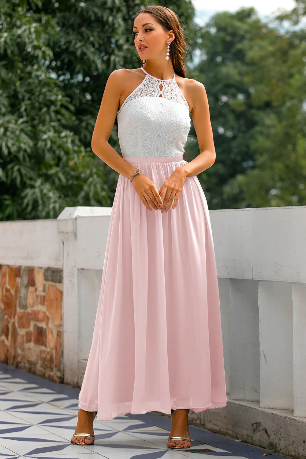Model wearing an elegant halter maxi dress, styled perfectly for a wedding guest.