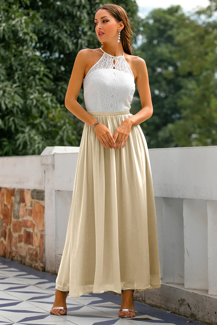 Close-up of the halter neckline detail on an elegant women's maxi dress.