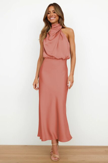 Stylish women's long halter neck dress. Beautiful maxi design for evening wear, formal parties, & summer events.