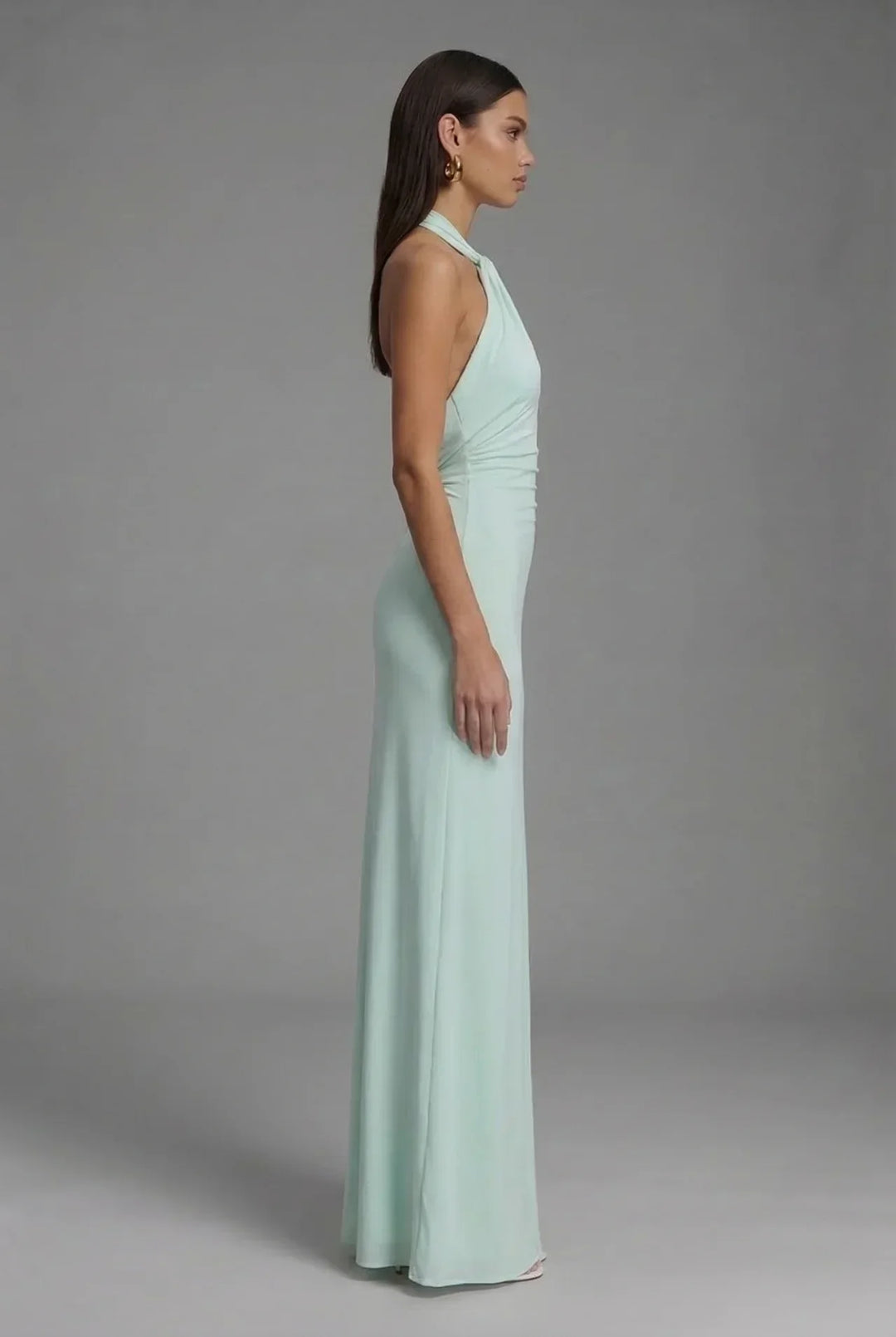 Chic women's sleeveless halter neck maxi dress featuring a flattering backless silhouette & stylish ruched fabric.