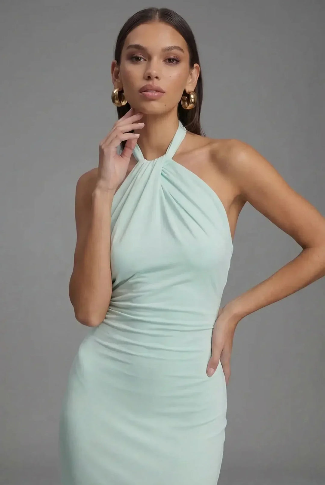 Formal women's halter maxi dress, backless & ruched. An elegant choice for parties, special occasions, or evening wear.