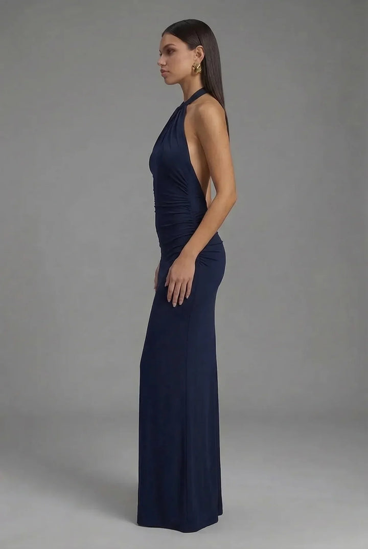 Sophisticated women's halter neck backless ruched maxi dress. A stylish formal or cocktail dress for any elegant occasion.