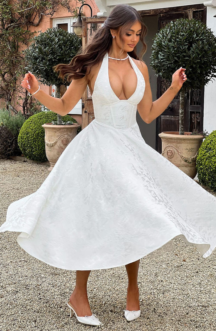 Women's formal halter neck midi dress, an impeccable choice for evening wear.