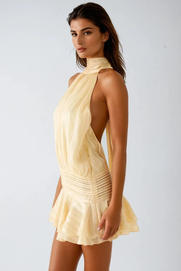 Close-up of the textured fabric on the women's halter neck ruffle mini dress