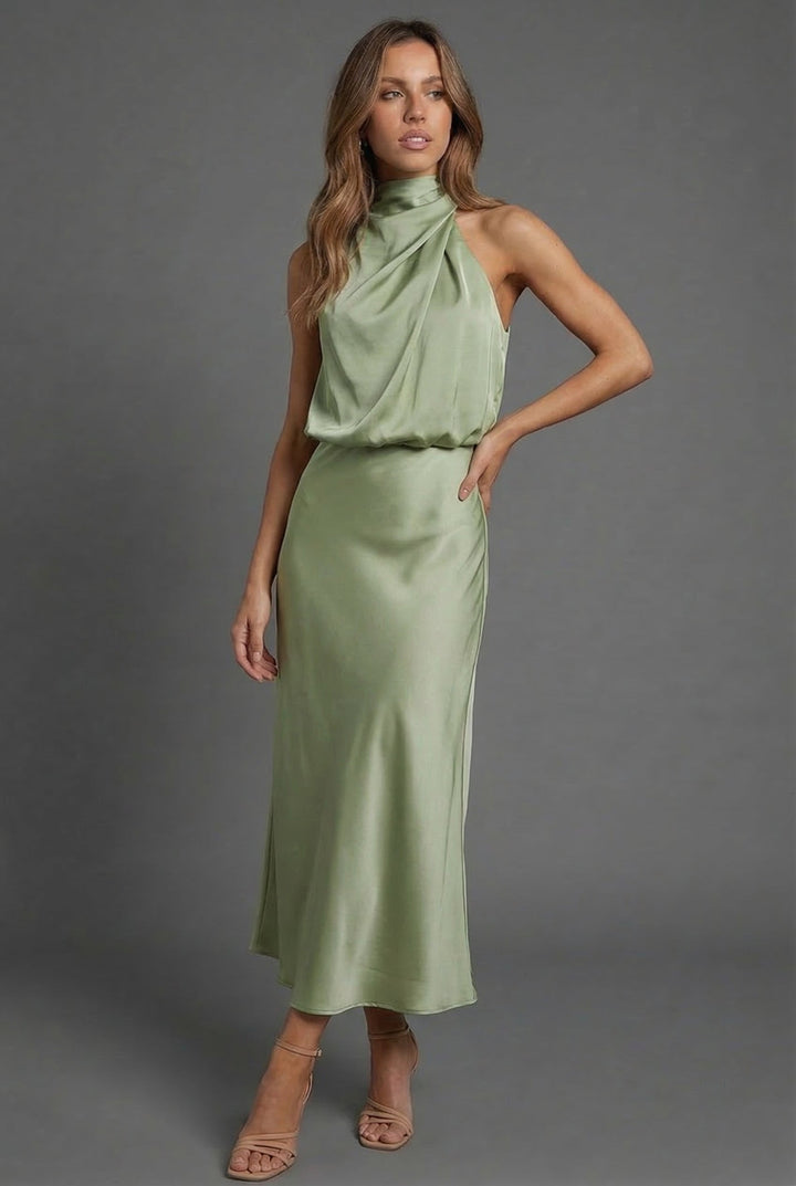Fashionable women's halterneck midi dress, perfect as a chic wedding guest outfit or party dress.