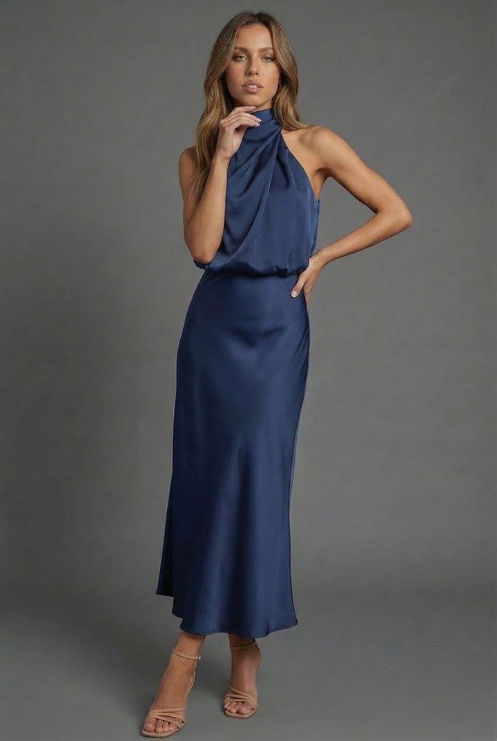 Summer wedding guest midi dress for women, featuring a chic halterneck and open back design.