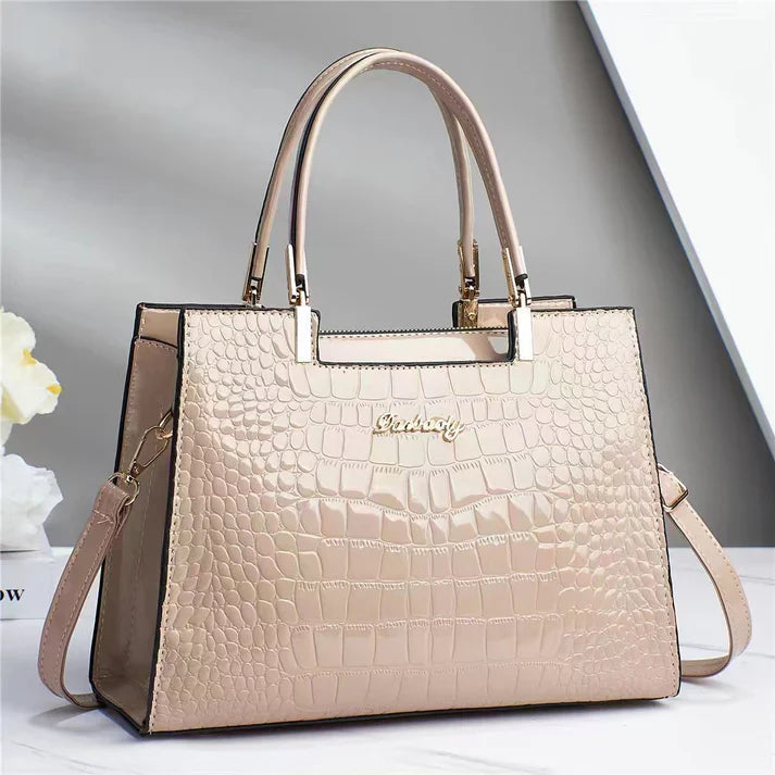 Elegant women's handbag with stylish glossy finish. Perfect formal accessory or chic daily carry.
