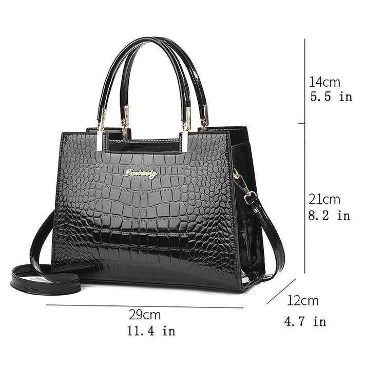 Chic structured women's handbag with glossy finish. Versatile purse for work, evening, or daily fashion.
