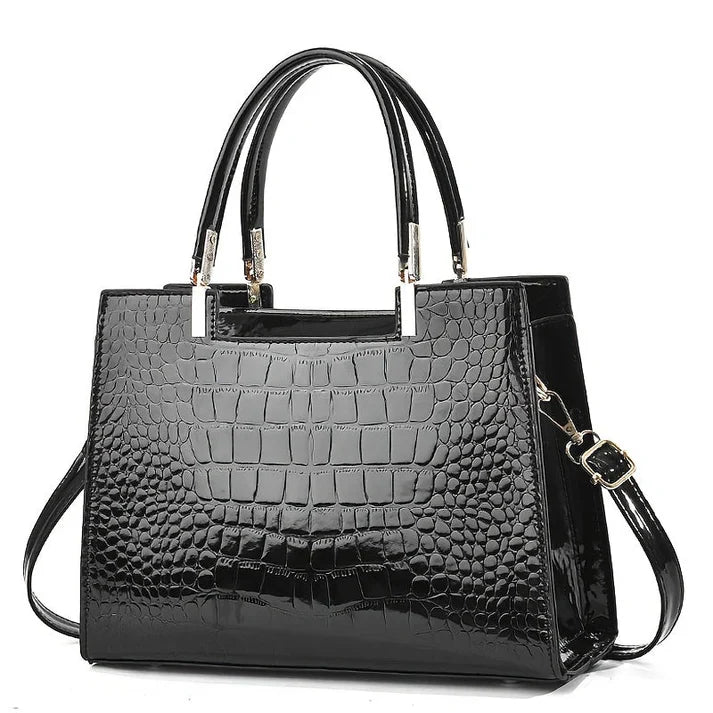 Versatile glossy women's handbag, an elegant accessory. Ideal for daily carry, work, or formal occasions.