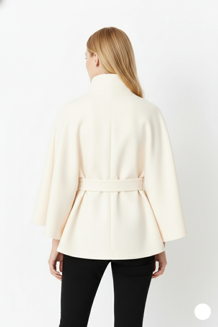 Close-up of the belt buckle and high collar on a women's winter coat, emphasizing design elements.