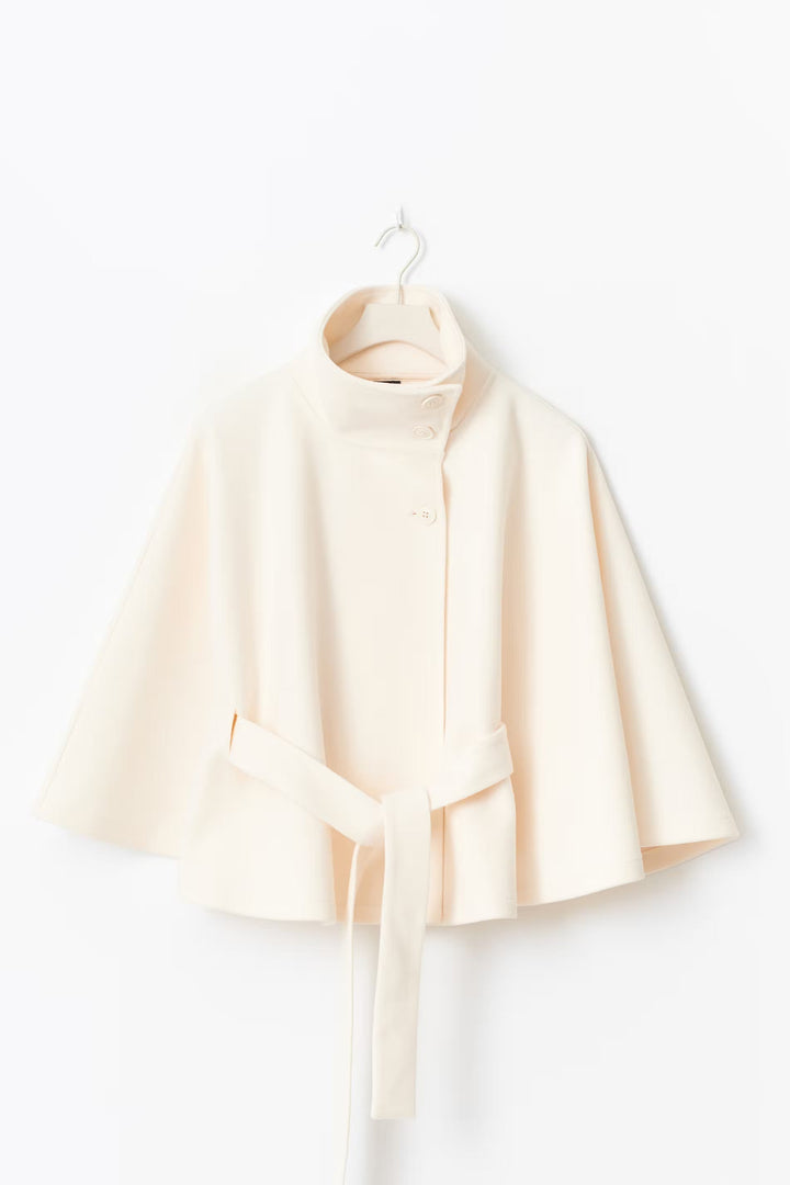 Women's belted winter coat, high collar, in a dark color, highlighting its sleek and classic fashion.