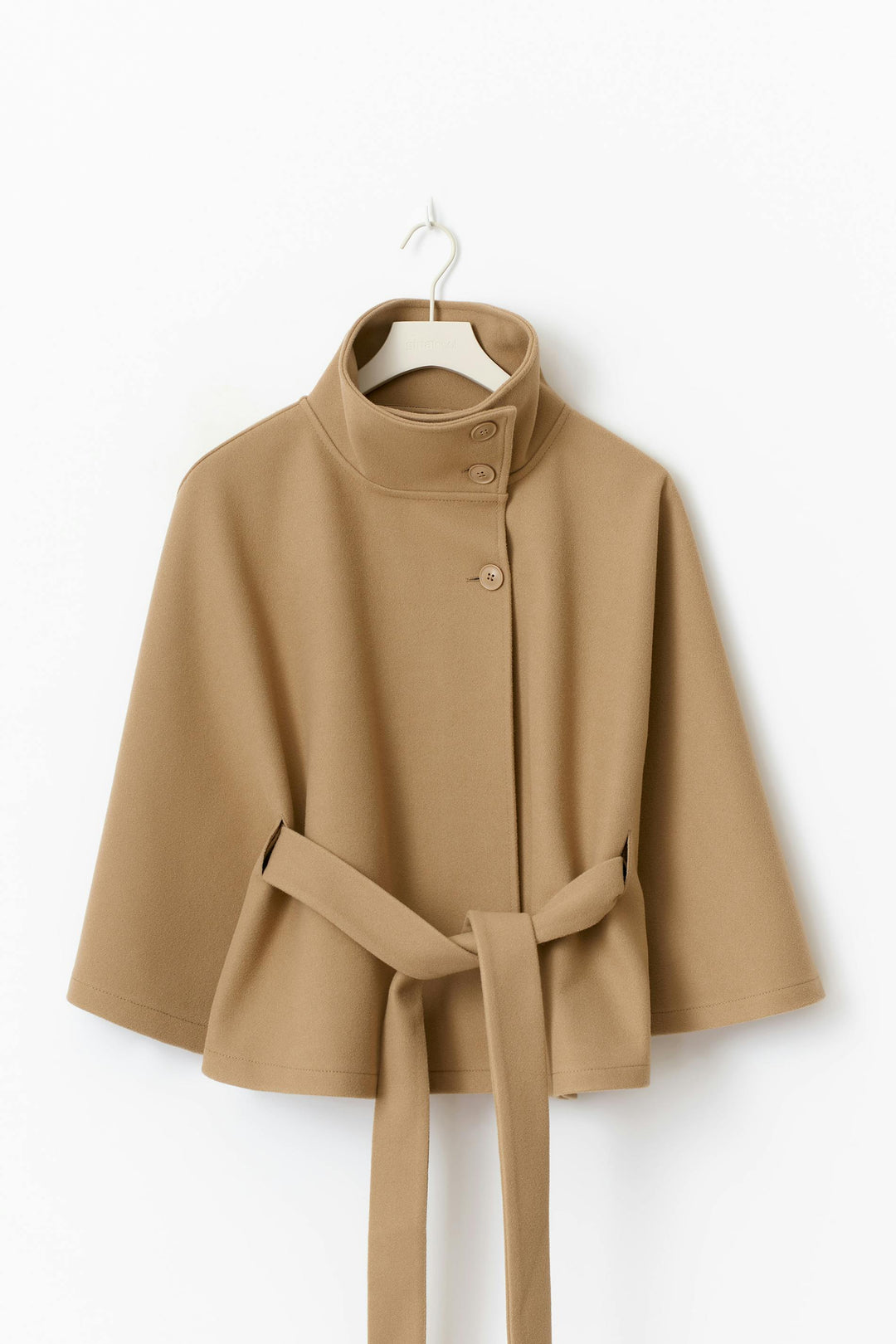 Stylish women's high collar winter coat with a cinched belt, offering a flattering warm fit.