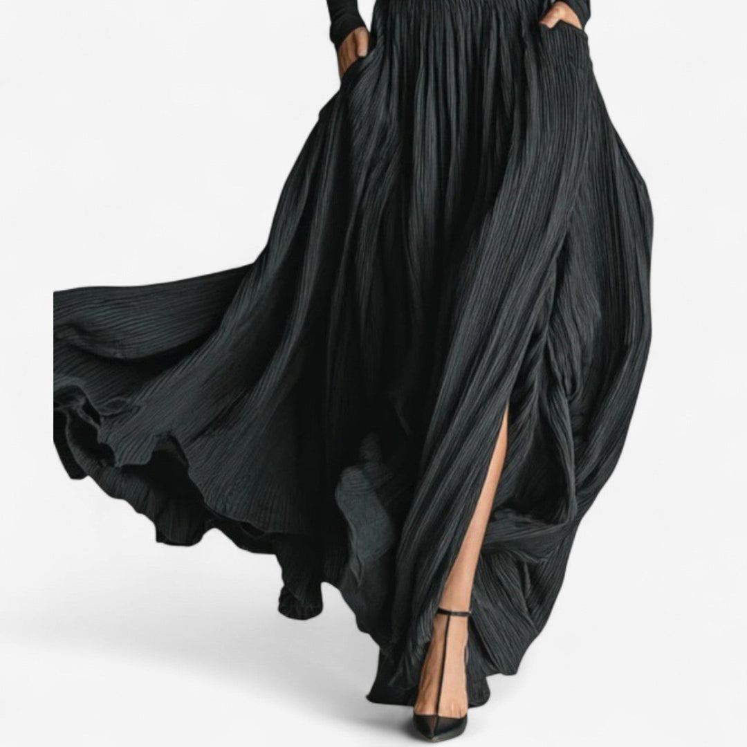 Women's fashion matching set with a flowy pleated high waist maxi skirt and long sleeve top.