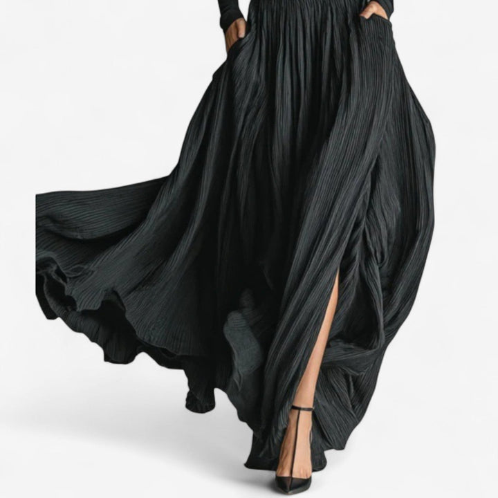 Women's fashion matching set with a flowy pleated high waist maxi skirt and long sleeve top.