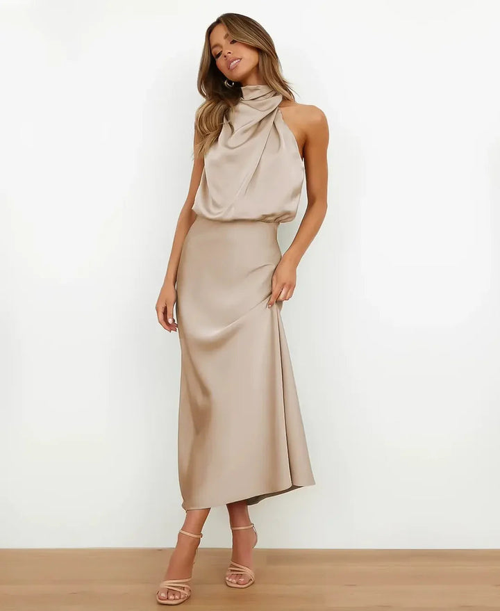 Full length image of a graceful women's high neck sleeveless midi dress, purple color