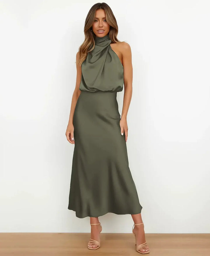 Close-up of the high waist detail on a women's sleeveless midi party dress, flattering design