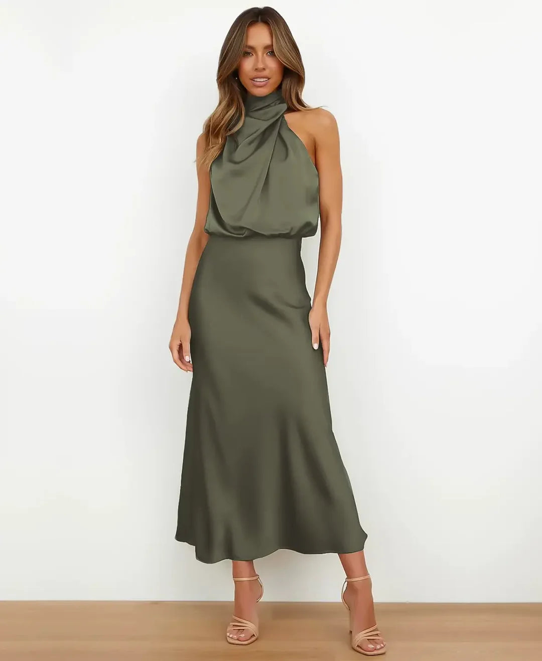 Back view of a women's sleek black sleeveless midi dress, high neck design