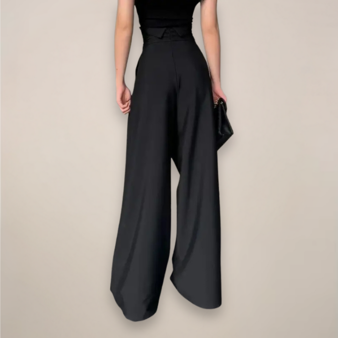 Close-up of black wide leg high waisted women's trousers, showcasing fabric detail for summer clothing.