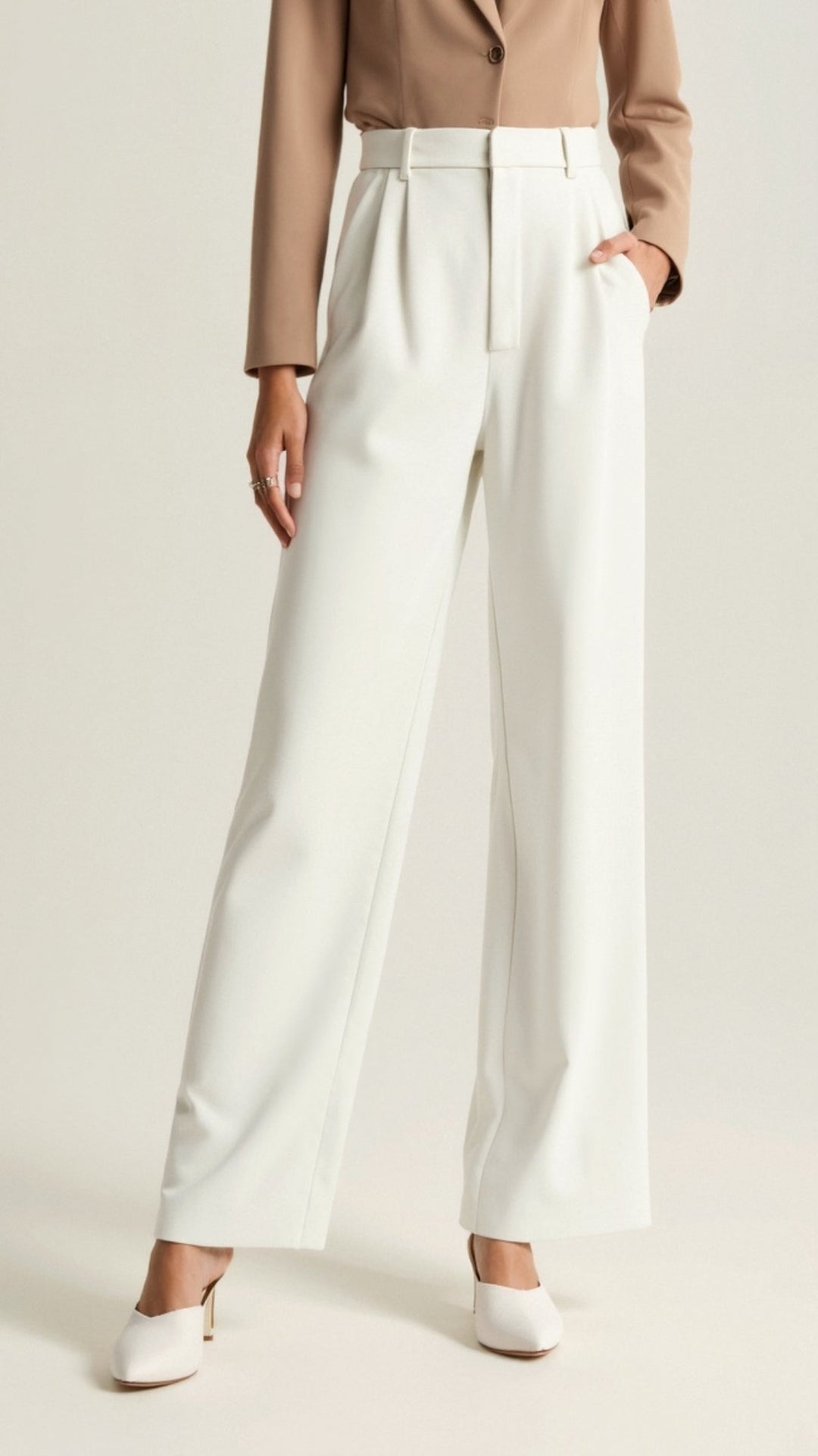 Plus size women's high waisted wide leg trousers in a flattering cut, promoting body positivity