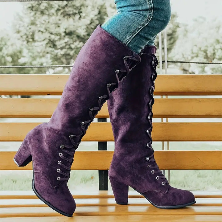Fashionable women's knee-high boots featuring a comfortable block heel for elegant everyday style.