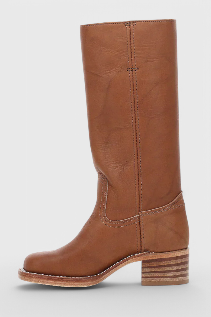 Chic black knee-high boots for women, providing elegance & comfort with a durable stacked heel.