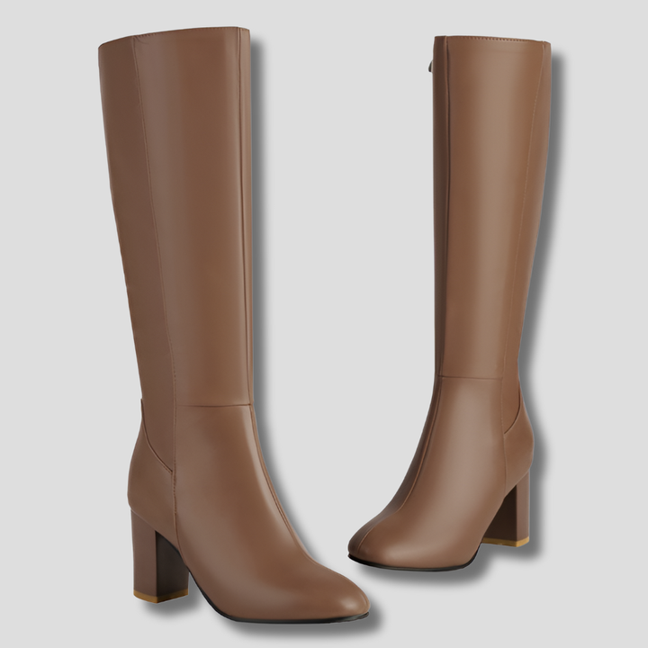 Close-up of the side zipper on elegant women's knee-high heeled boots, highlighting quality craftsmanship.