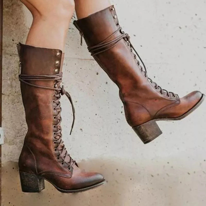 Classic black women's knee-high boots featuring lace-up front and comfortable block heel design