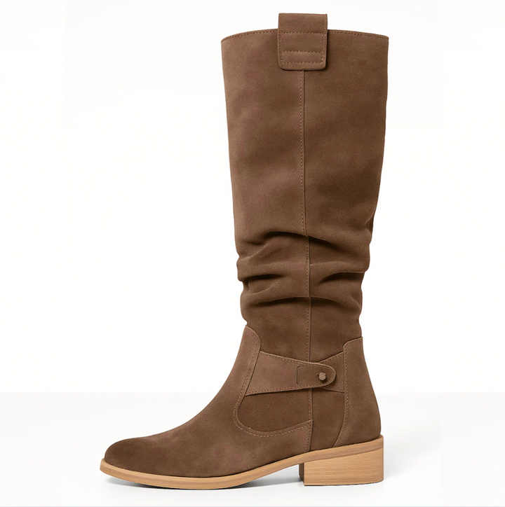 Stylish women's knee-high suede boots, combining comfort with a timeless elegant aesthetic