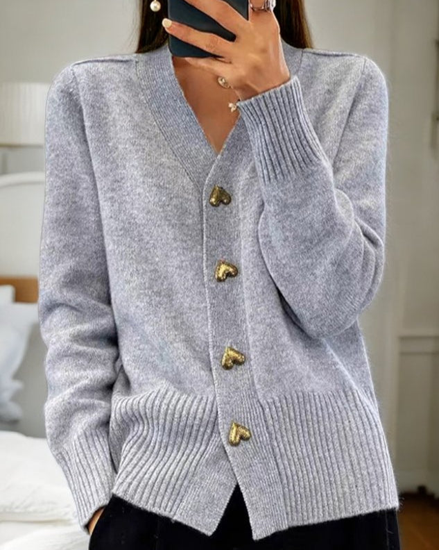 Elegant women's knit cardigan with heart buttons, v-neck, perfect for fall fashion.