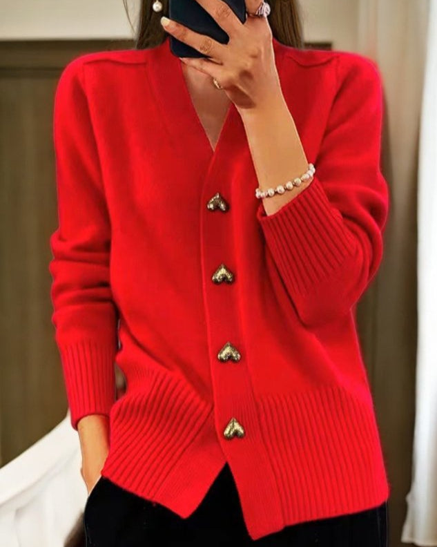 Winter wear women's knit cardigan, soft fabric, stylish heart buttons, and v-neck design.