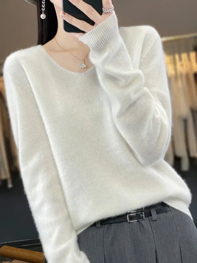 Modern women's knit sweater, a chic, soft & versatile long-sleeve top for any elegant occasion.