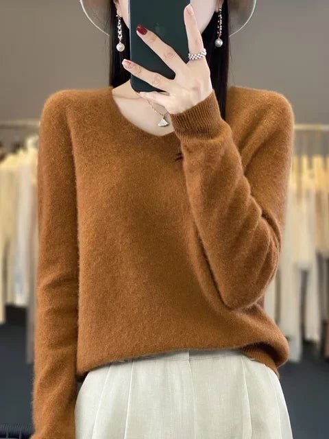 Classic women's knit sweater, long-sleeve pullover for a cozy and elegant look in winter fashion.