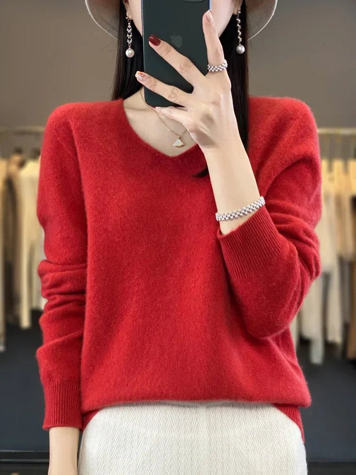 Close-up of elegant women's knit sweater fabric, showing soft texture and quality knitwear.