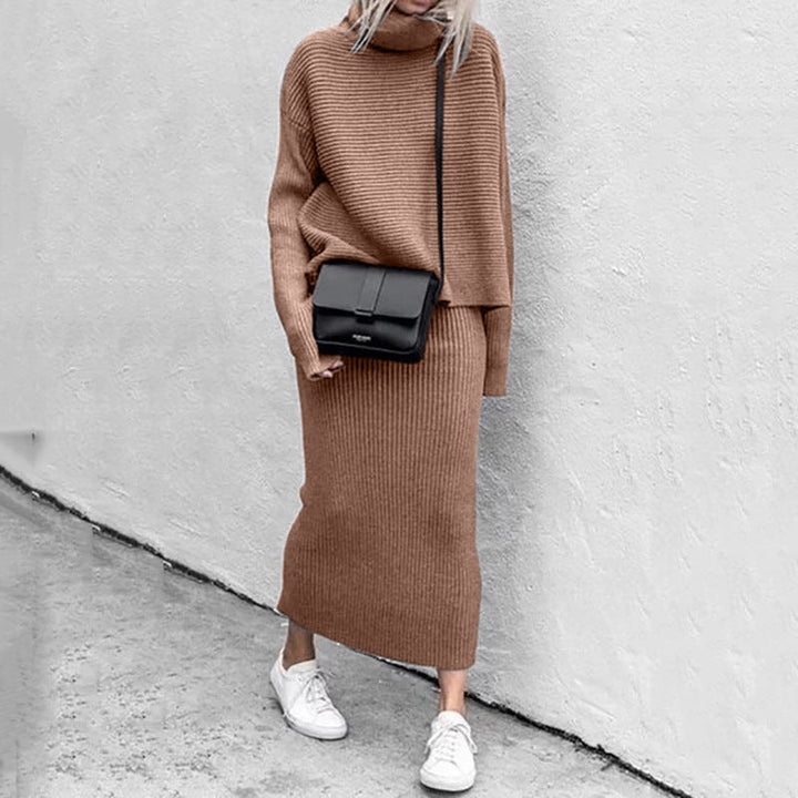 Women's knitted set featuring a sophisticated sweater and matching skirt, ideal for cozy style.
