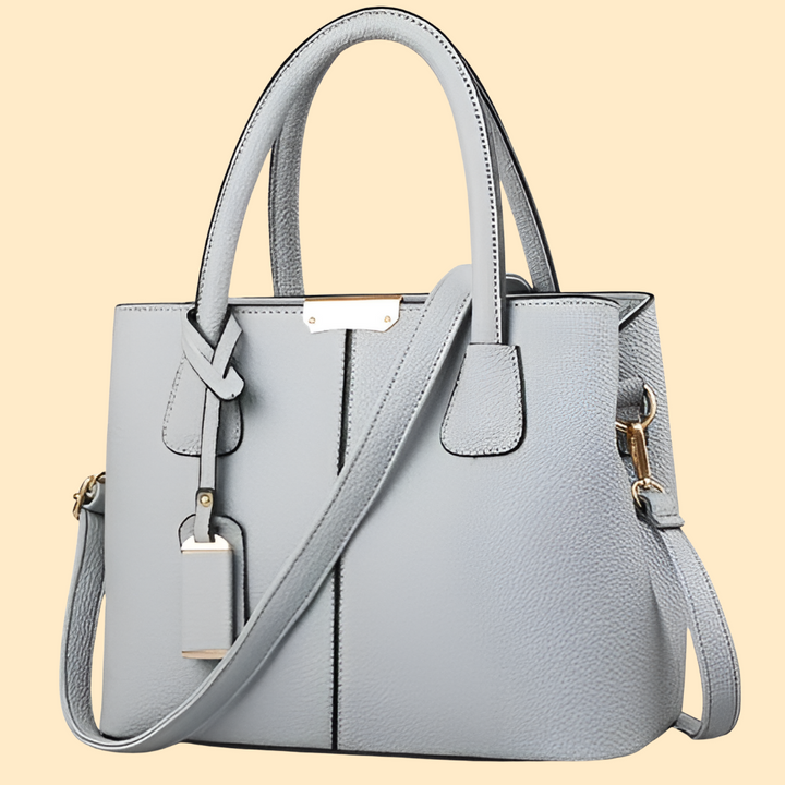 Stylish women's leather crossbody bag in a rich brown hue, ideal for casual and formal outfits.